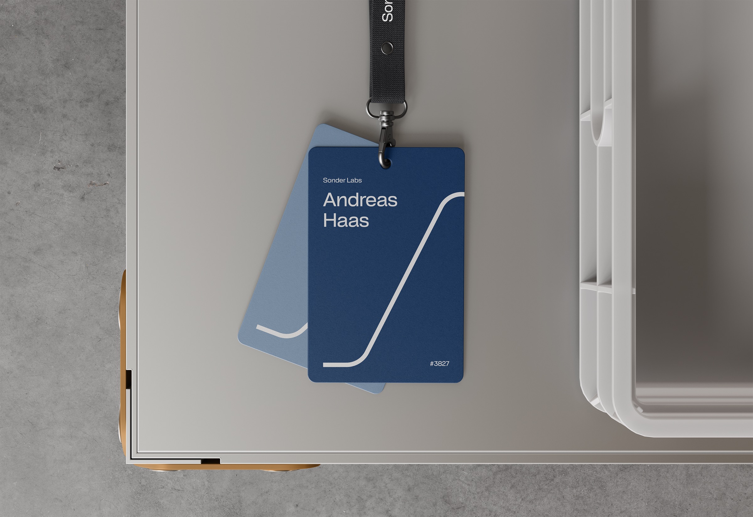 Sonder Labs ID badges on a lanyard